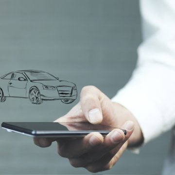 car insurance root insurance app man in white shirt holding smartphone car drawing above phone 